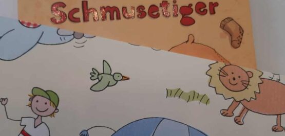 Ein Kinderbuch mit dem Bild eines Elefanten und einer Giraffe.